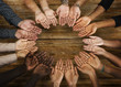 DIverse hands are together in a circle shape