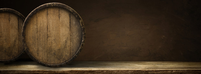 Old wooden barrel on a brown background