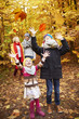 © gpointstudio - Cheerful children catching autumnal leafs