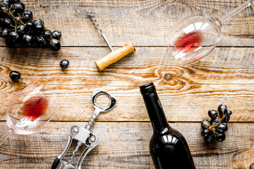 Wine set with bottle and grape on desk top view