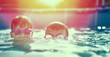 © sakkmesterke - Two little kids in goggles swimming in pool at sunset