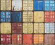 © Erik_AJV - Stack of colourful and rusty containers in the port of Antwerp.
