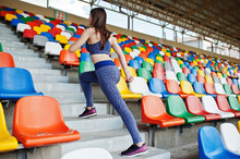 Active Young Woman Running Up On Stairs In The Stadium.