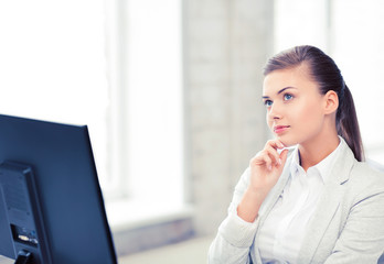 Wall Mural - pensive woman in office