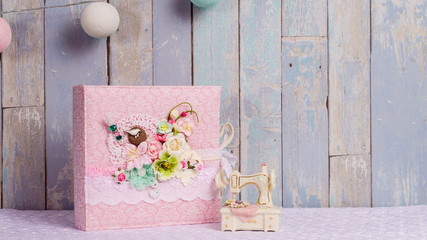 Wall Mural - a photo album in the style of shabby chic on a blue background.