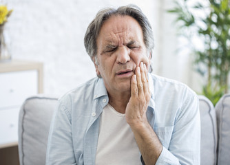 Wall Mural - Old man with toothache