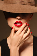 Poster - Beautiful young woman with bright lips in hat, closeup