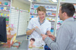 © auremar - pharmacist smiling while reading