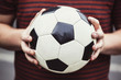A man holding a soccer ball