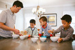 © Kristin Rogers Photography/Stocksy - Little boys eating breakfast at home