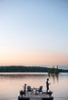 © Cara Slifka/Stocksy - Father and son fish together on a lake at dusk