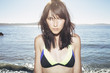 © Ania Boniecka/Stocksy - Beautiful girl in a bikini on the beach in Tofino, Canada