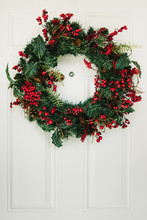 Christmas Wreath Hanging On The Door