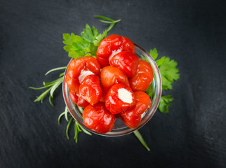 Wall Mural - Some Filled Pimientos on a dark slate slab