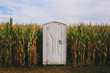 © Gabrielle Lutze/Stocksy - Outhouse in Corn Maze