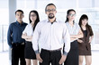 © Creativa Images - Afro businessman and his team in lobby