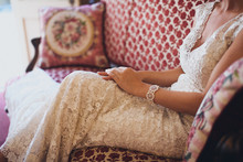 Bride Sitting On A Victorian Couch