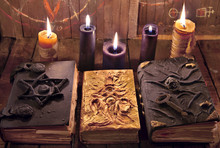 Mystic Halloween Still Life. Three Magic Books With Burning Candles On Planks. 