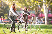 Couple Riding Bicycles In Autumn