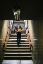 Man Climbing The Stairs Of Subway Station In Milano