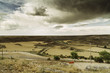 © Javier Pardina/Stocksy - landscape with roads and cloudy sky