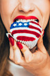 © Aila Images/Stocksy - Big Bite of American Flag Cupcake