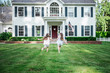 © Take A Pix Media, LLC/Stocksy - Young twin sisters playing in the front yard of their home