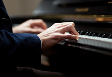 Close Up Of A Musician Playing A Piano Keyboard