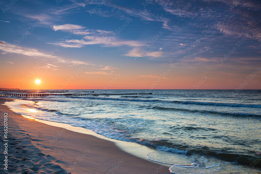 Sunset on the beach on the Baltic Sea - obrazy, fototapety, plakaty 