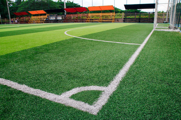 Wall Mural - Photo of a green synthetic grass sports field with white line shot from above