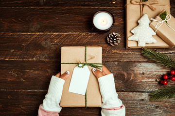 Wall Mural - Craft and handmade present gift boxes of Christmas on wood table background. Creative Flat lay and top view composition. vintage color tone style.