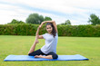 © michaelheim - Teenage girl practising yoga outdoors