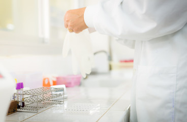 scientist working in white laboratory.