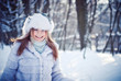 © ViDi Studio - Beautiful girl in a winter snowy park