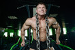 © antondotsenko - Brutal strong bodybuilder man pumping up muscles and train gym