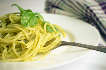 Wall Mural - Italian pasta spaghetti with homemade pesto sauce and basil leaf