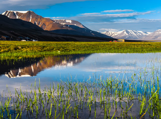 Wallpaper norway landscape nature of the mountains of Spitsbergen Longyearbyen Svalbard building city on a polar day with arctic summer in the sunset and blue sky with clouds