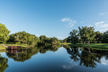 Fishing Dock On Reflective Neighborhood Pond Tampa Florida  2