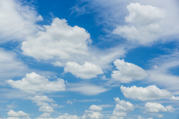Wall Mural - beautiful fluffy white cloud flowing against blue sky.