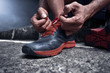 © fotokitas - Man tying running shoes