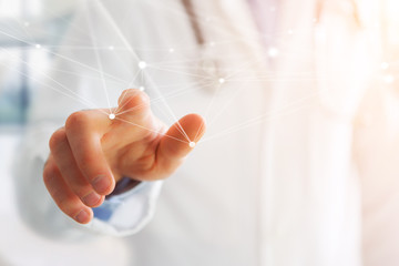 Hand of a doctor touchnig an operating system screen and network connection