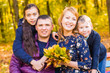 © satura_ - Family, nature, autumn and people concept - Portrait of Happy mother, father, son and daughter in fall