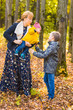 © satura_ - Family, nature, autumn and people concept - Portrait of Happy mother, son and baby in fall