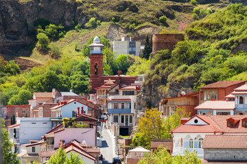 Wall Mural - Tbilisi, old part of town with cafe, restaurants, cobbled pavement and antique buildings. Minaret of Jumah Mosque in Abanotubani area.Georgia.