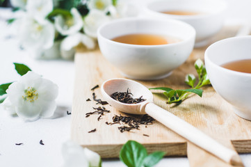 Green tea with a jasmine in white cups