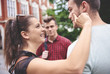 © gpointstudio - Smiling, crazy woman accostting man