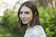 © fStop - Close-up portrait of smiling young woman with short brown hair
