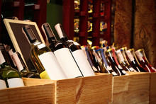 Bottles Of Wine In Wooden Crates At Store