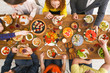© Prostock-studio - People eat healthy meals at served table dinner party