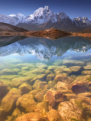 Wall Mural - nepal, manaslu region, a reflection in the bimtang lake (3,680 m) of the phungi peak (6,538 m) in th